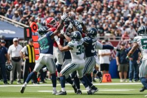 Football players leaping in the end zone trying to catch a Hail Mary pass during a high-stakes game